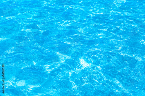 Surface of blue clear swimming pool. Water background pattern for background.