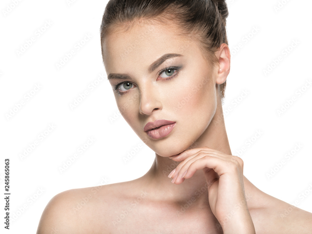 Beautiful woman cares for the skin face - isolated on white Beautiful woman cares for the skin face - isolated on white