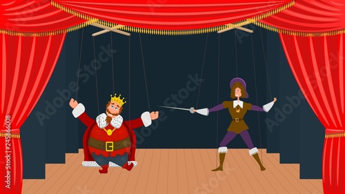 Children's puppet theater with two dolls on threads. Puppet theater with red scenes, two marionette in costumes of the king and prince.  Kid's entertainment and leisure