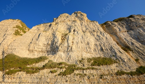 White cliffs on the beach of Fecamp, France photo