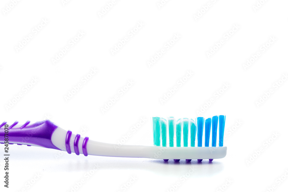 colored toothbrush on an isolated background, close up colored toothbrush on an isolated background, close up