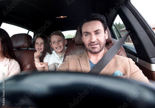 happy family travelling by car