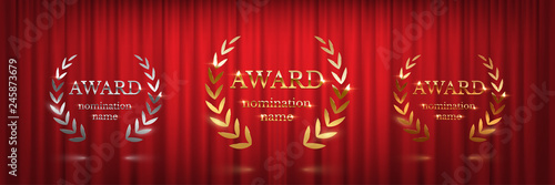Golden, silver and bronze award signs with laurel wreath isolated on red curtain background. Vector award design templates.