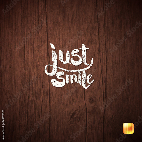 White Simple Text concept Just Smile on Wood.