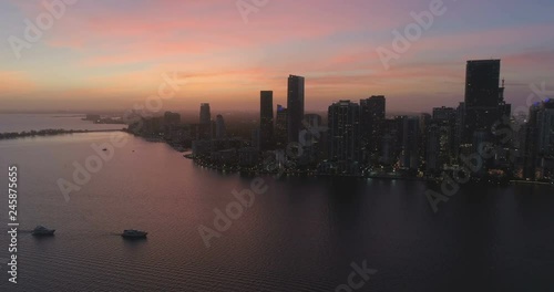 Wallpaper Mural Flying above the ocean, Miami downtown skyline at sunset, Florida Torontodigital.ca
