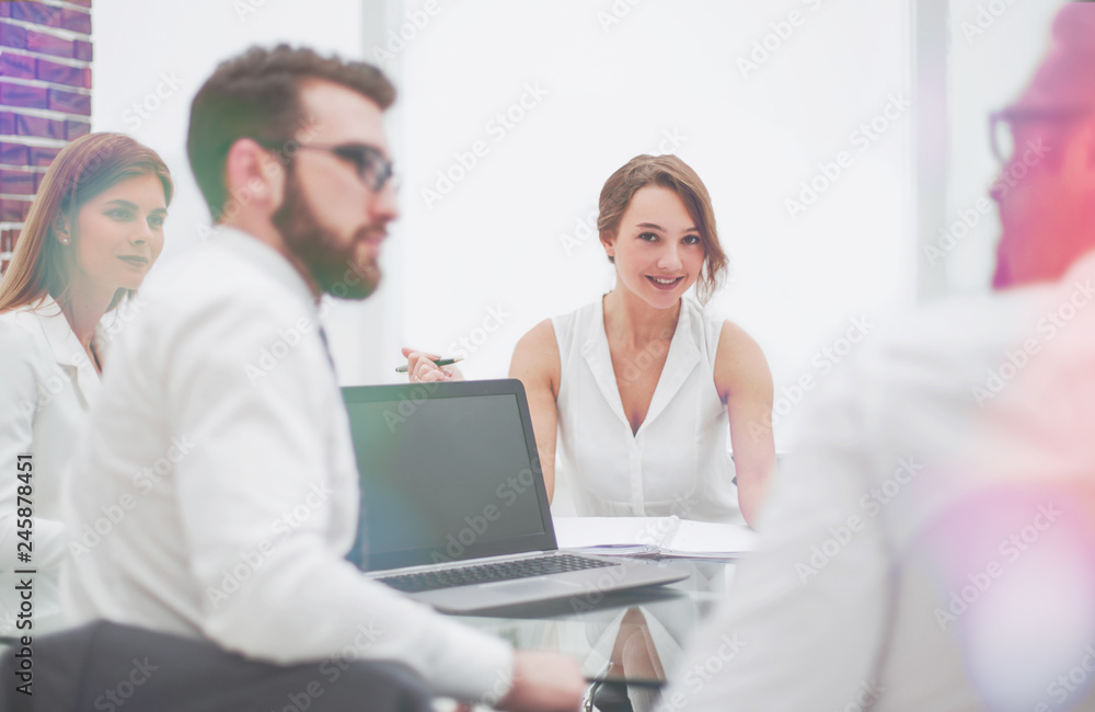 rear view.business colleagues sitting at the Desk rear view.business colleagues sitting at the Desk