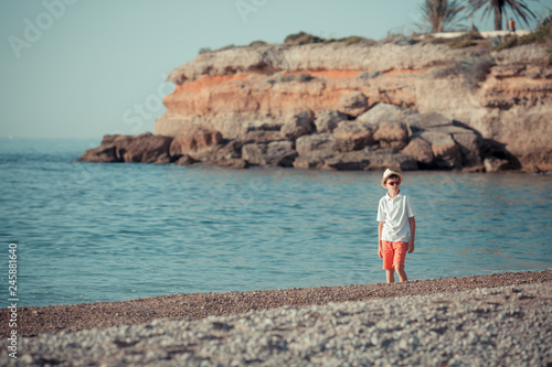 Portrait of teenager standing near sea