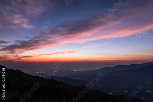 twilight of mountain with city light at dawn, taken from viewpoint of Mon Long, Mae Rim Chiang Mai, Thailand
