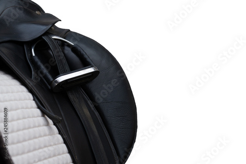 Bild auf Leinwand Riding saddle in close-up with stirrup inserted, free!.