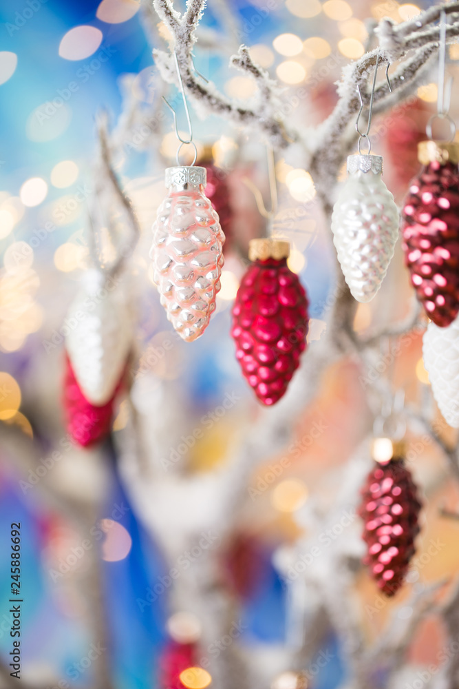 Christmas greeting card. Pine decoration on bokeh background. New Year concept. Copy space.