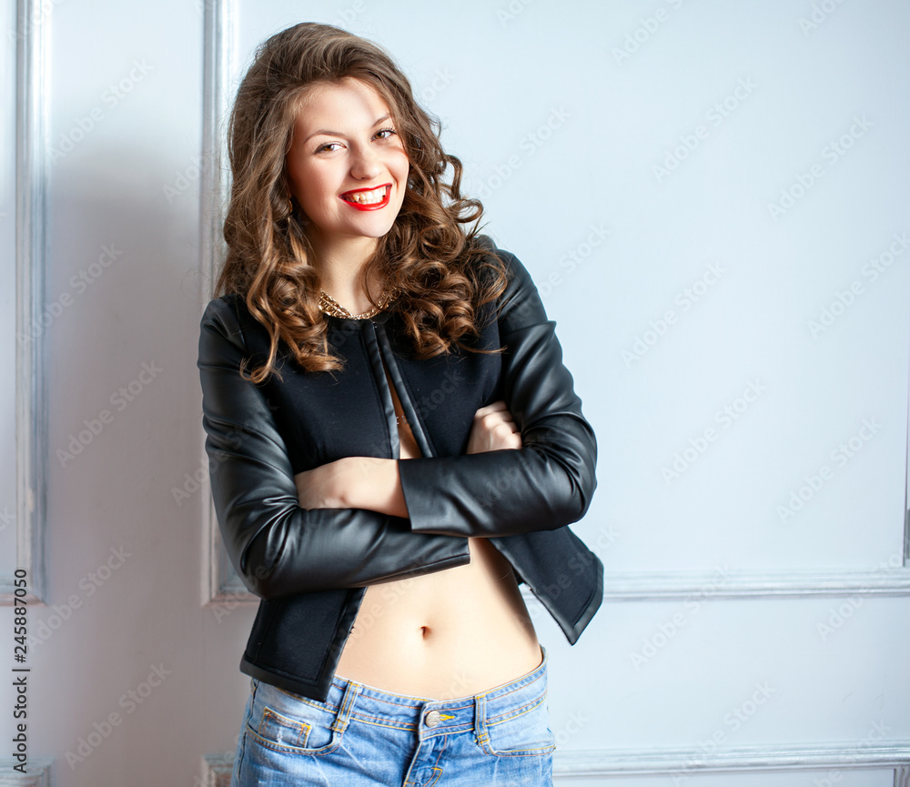 Beautiful Sexy Hot Naked Girls - Beautiful sexy woman in denim jeans shorts and black jacket wearing on naked  body posing near the wall. Stock Photo | Adobe Stock