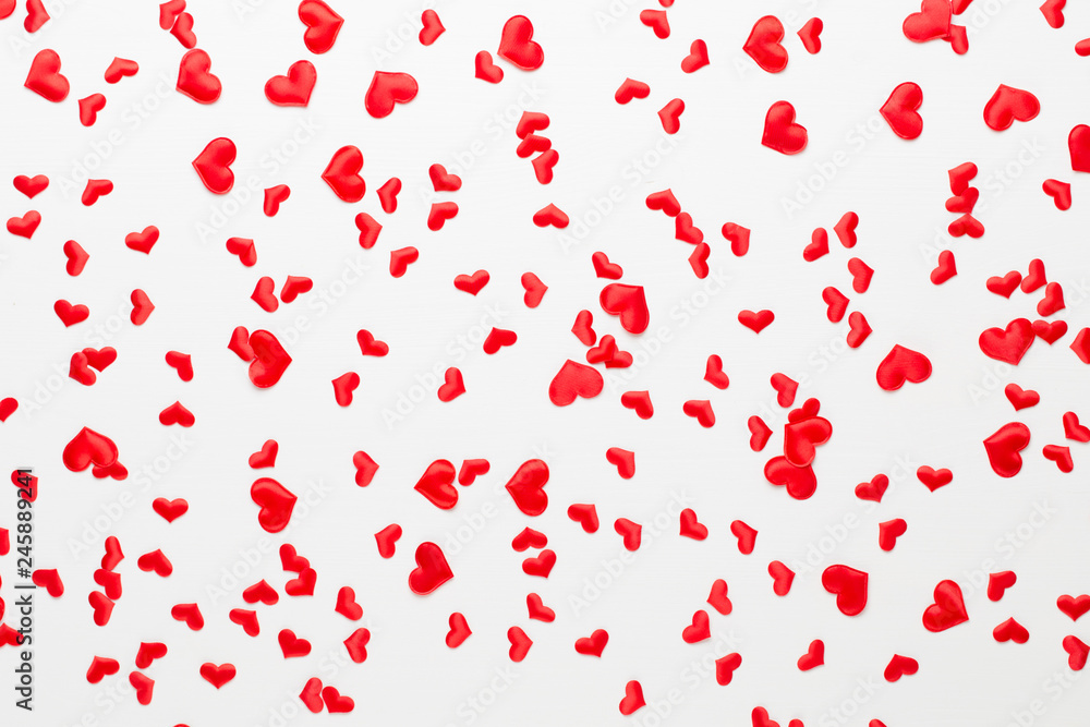 Valentines day background red hearts on wooden background.