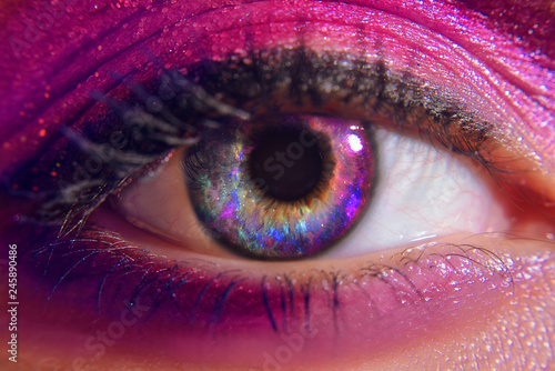 Beautiful eyes of the girl, space. Lenses for eye space. Cosmos in the eyes of the girl. Girl with trandy pink make up. Mysterious view. Magic eye. Panoramic looking into deep space. Wonam eyes love.
