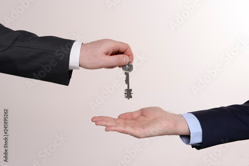 hand with keys isolated on white background