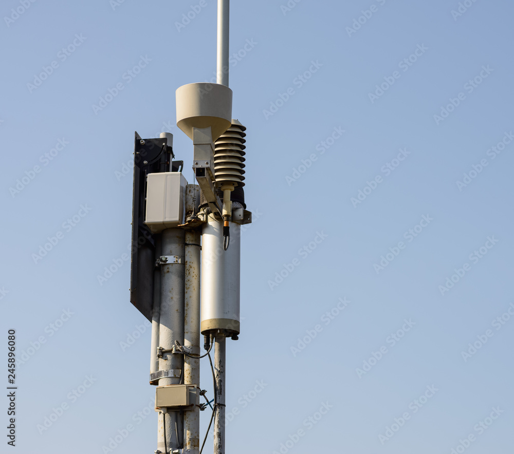 Automatic weather station on blue sky background. Automatic weather station on blue sky background.