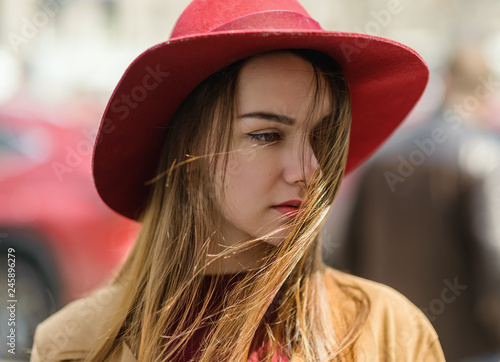 Woman in vintage cloak and red hat. © Vladimir Arndt