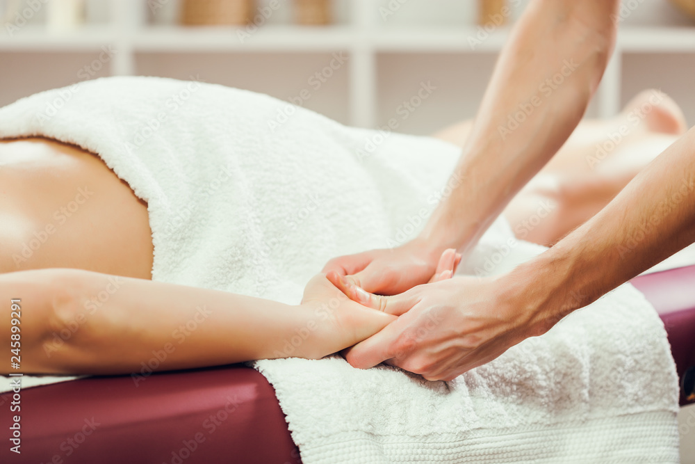 Fototapeta premium Young woman is having massage on spa treatment.