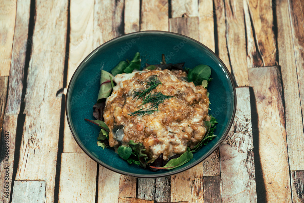 Moussaka, Oriental dish common to Turkey, Greece and the Balkans, consisting of aubergines baked. Moussaka, Oriental dish common to Turkey, Greece and the Balkans, consisting of aubergines baked.
