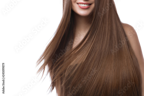 Tableau sur toile Beautiful brown-haired girl in move with a perfectly smooth hair, and classic make-up