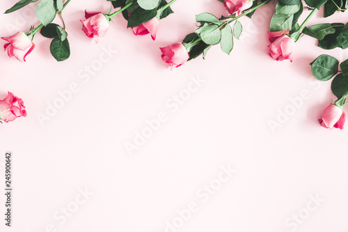 Flowers composition. Pink rose flowers on pastel pink background. Valentines day, mothers day, womens day concept. Flat lay, top view, copy space