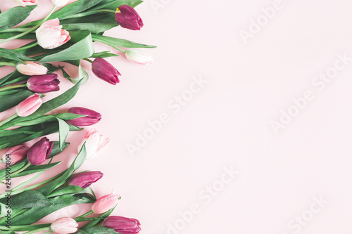 Fototapeta Naklejka Na Ścianę i Meble -  Flowers composition. Tulip flowers on pastel pink background. Valentines day, mothers day, womens day, spring, easter concept. Flat lay, top view, copy space
