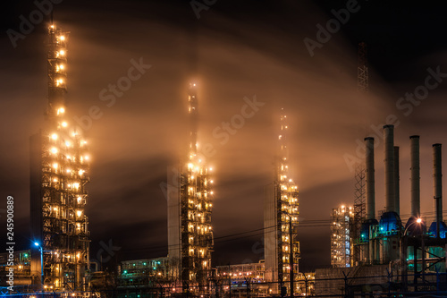 Chemical industry distillation towers detail at night. Petrochemical background. Long exposure at winter dusk. © Ded Pixto