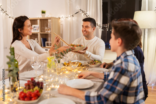 celebration  holidays and people concept - happy family having dinner party at home