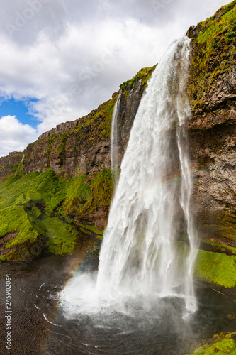 Seljalandsfoss waterfall and mist rainbow  Iceland