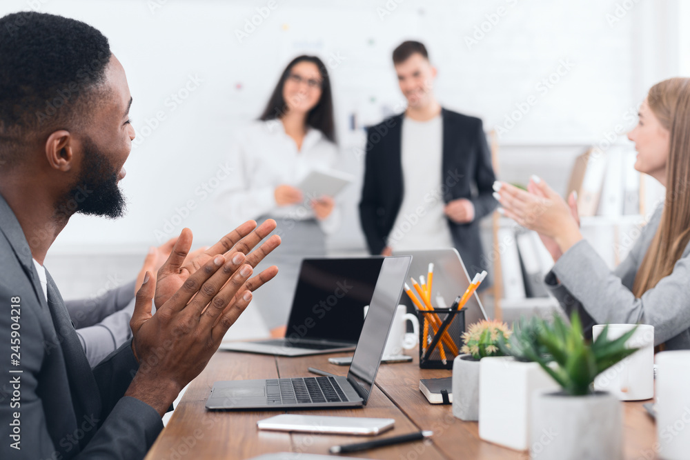 Business seminar. Colleagues clapping hands to speakers Business seminar. Colleagues clapping hands to speakers