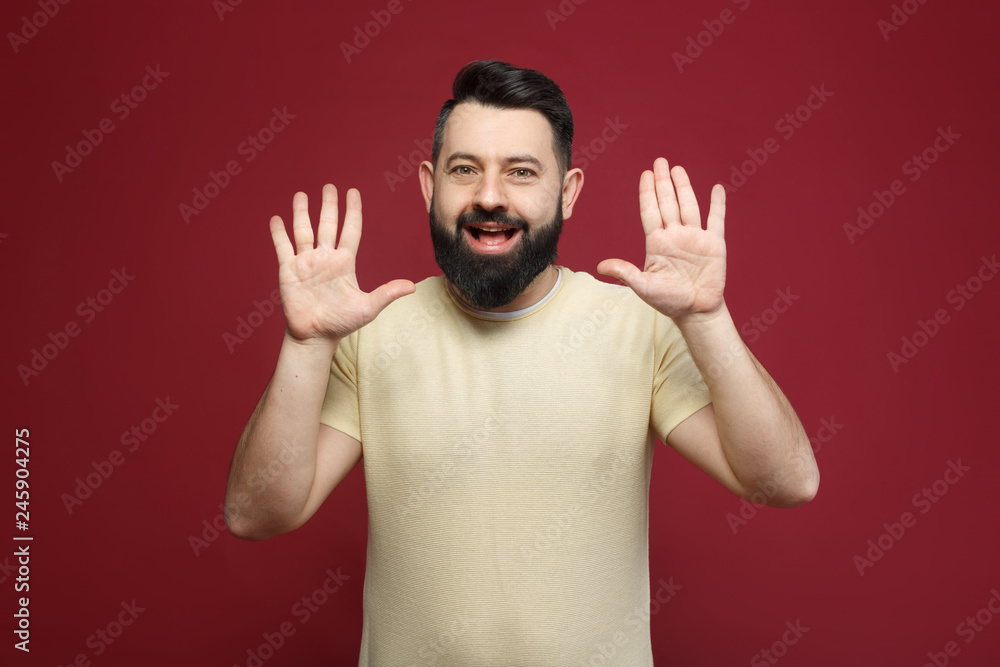 a young pretty cute brunette with a beard showing on her fingers ten a young pretty cute brunette with a beard showing on her fingers ten