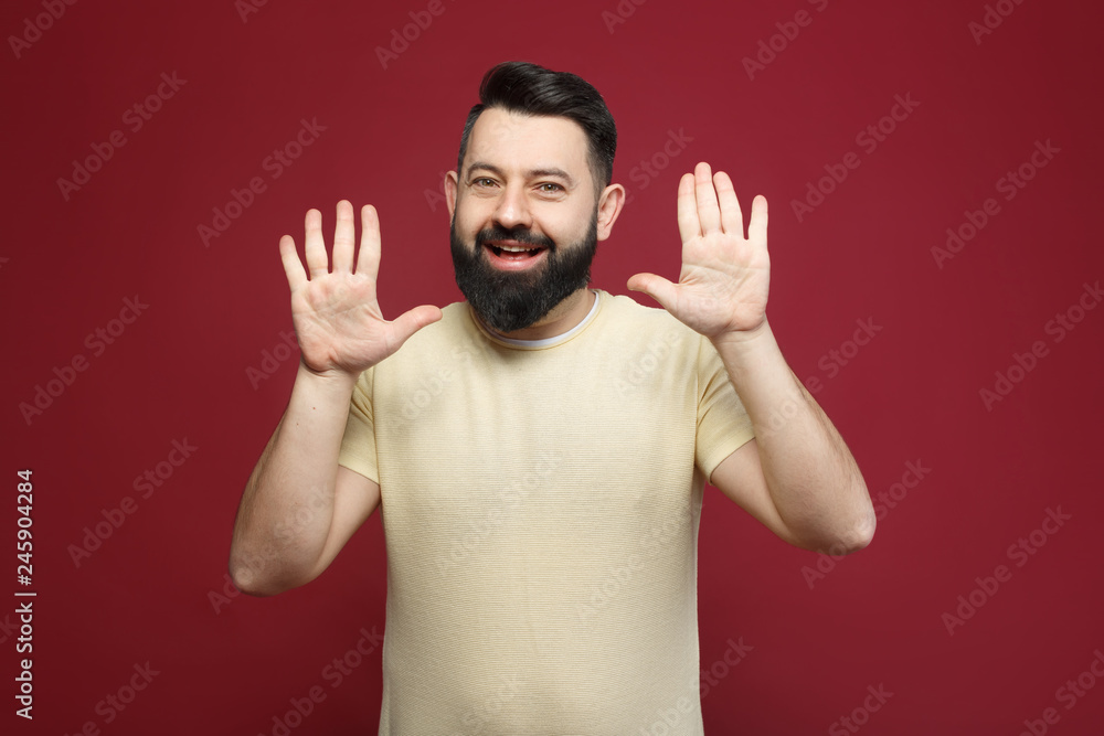 a young pretty cute brunette with a beard showing on her fingers ten a young pretty cute brunette with a beard showing on her fingers ten