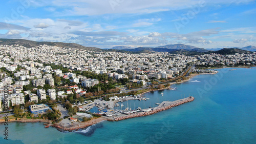 Aerial drone bird's eye view of small marina with boats docked in Voula, Athens riviera, Attica, Greece photo