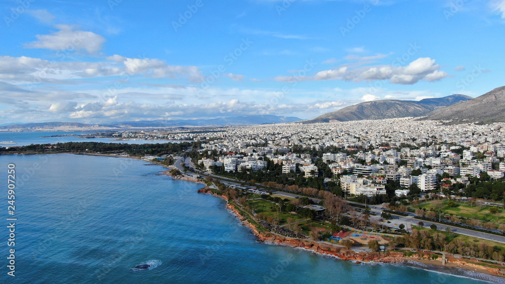 Aerial drone bird's eye view of small marina with boats docked in Voula, Athens riviera, Attica, Greece