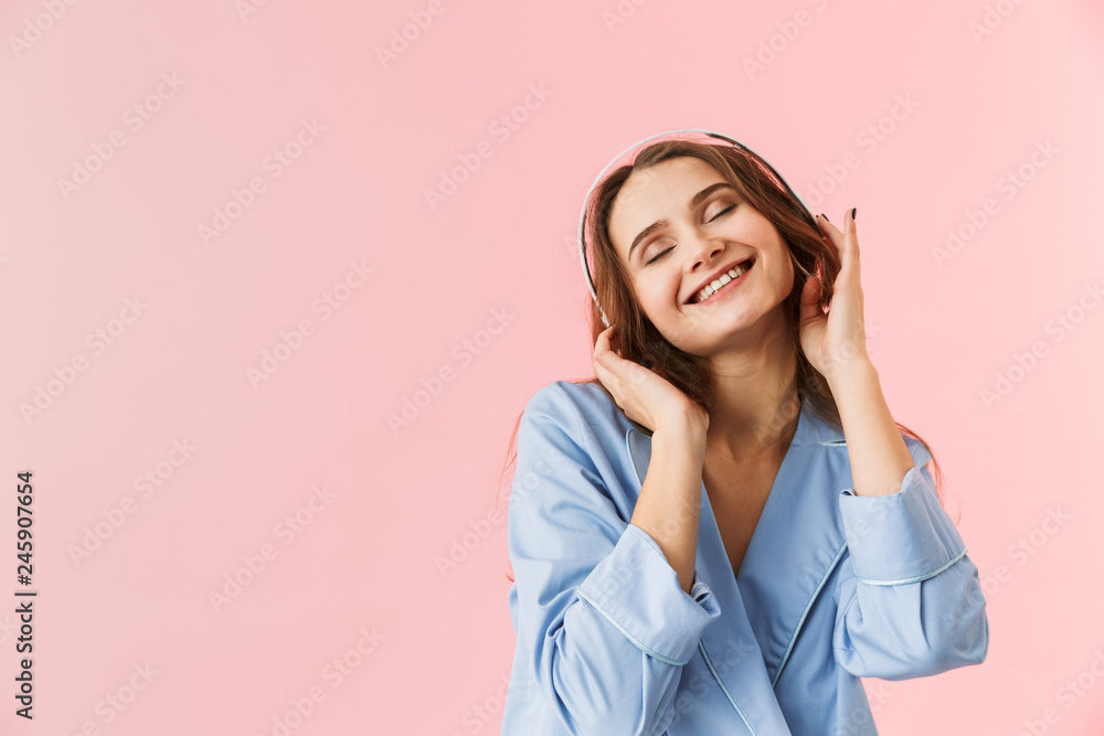 Beautiful young woman wearing pajamas standing Beautiful young woman wearing pajamas standing