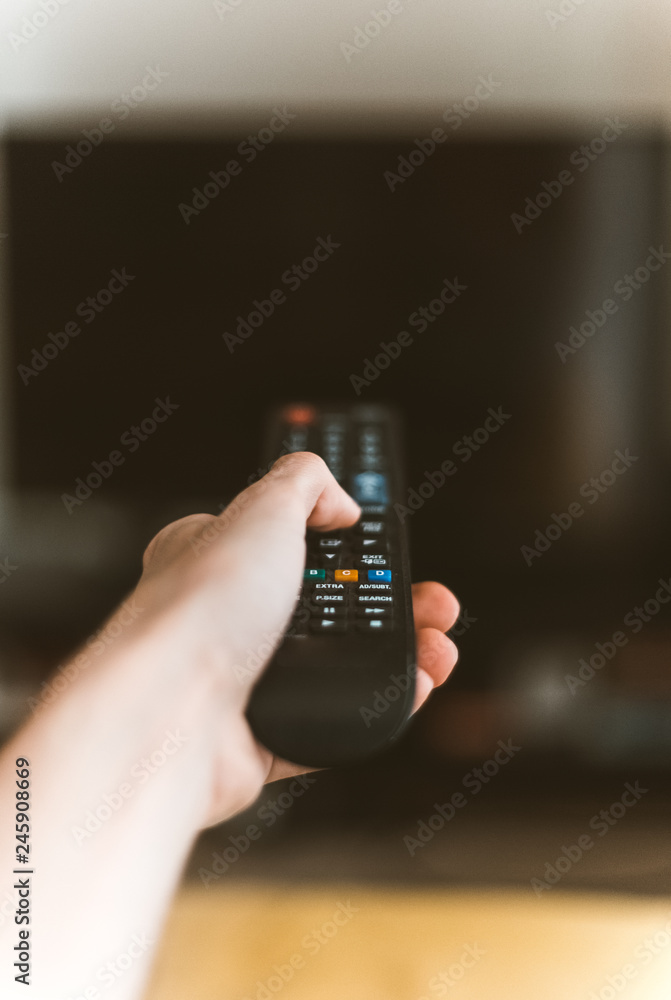 Fototapeta premium Close-up of hand holding remote control