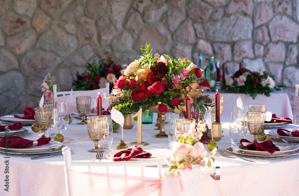 table decorated with fresh flowers and candles for a wedding dinner table decorated with fresh flowers and candles for a wedding dinner
