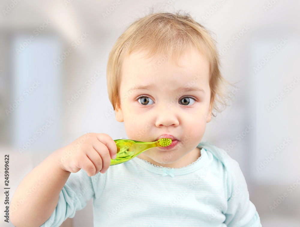 Child with toothbrush,kid brushing teeth.