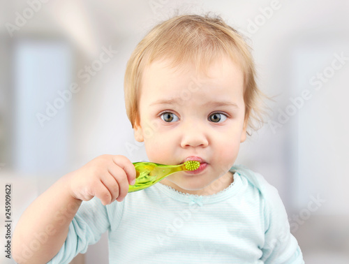 Child with toothbrush,kid brushing teeth.