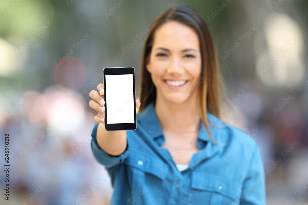 Happy woman showing smart phone mock up