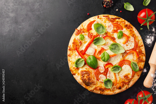 Tasty vegetarian pizza on dark background