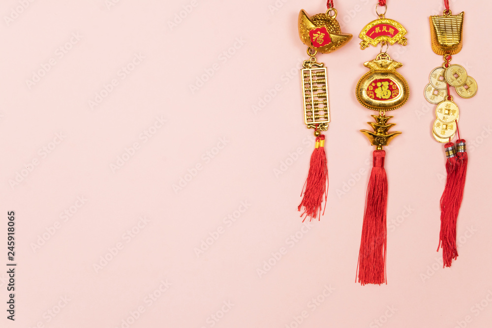 Happy Chinese New Year decoration on a pink background.  Amulet of wealth and lucky. Calligraphy mean rich.  Flat lay, Top view - Image.