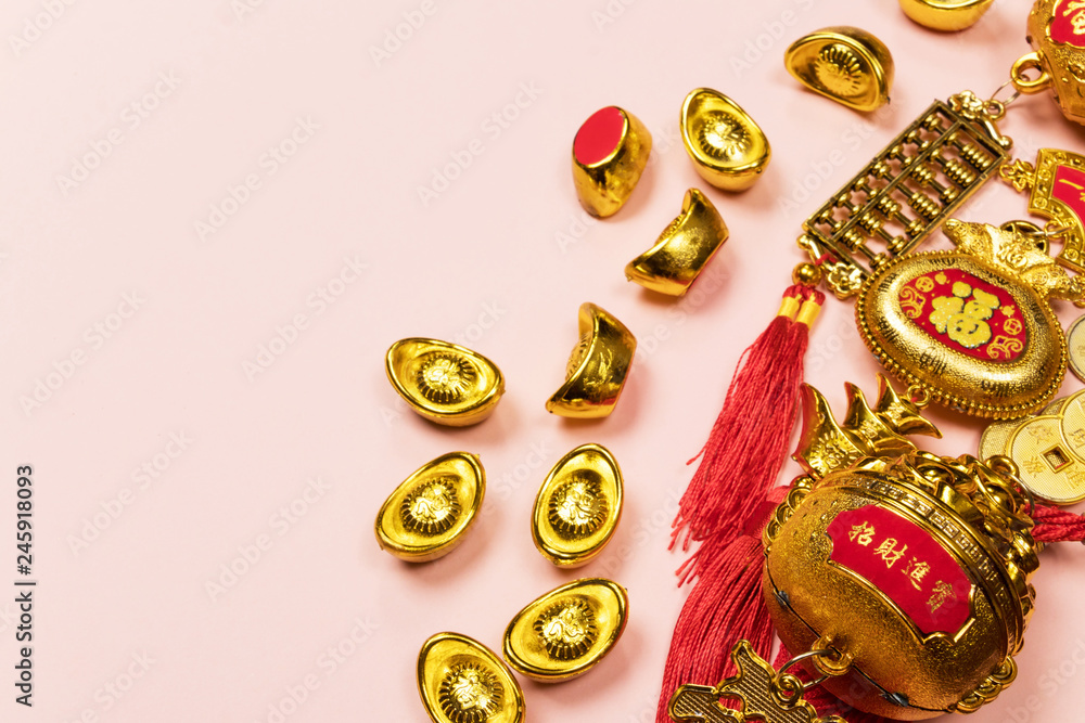 Happy Chinese New Year decoration on a pink background.  Amulet of wealth and lucky. Calligraphy mean rich.  Flat lay, Top view - Image.