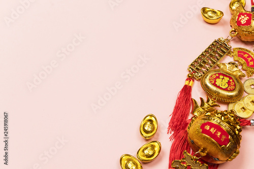 Happy Chinese New Year decoration on a pink background.  Amulet of wealth and lucky. Calligraphy mean rich.  Flat lay  Top view - Image.