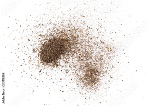 Ground black pepper powder isolated on white background, top view