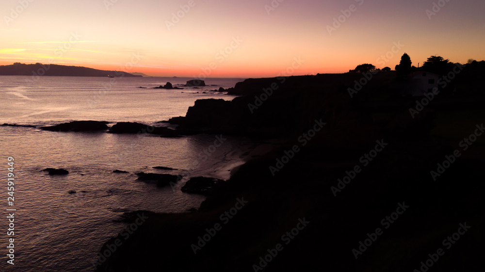 Fototapeta premium Aerial view of cliiffs at the sunset