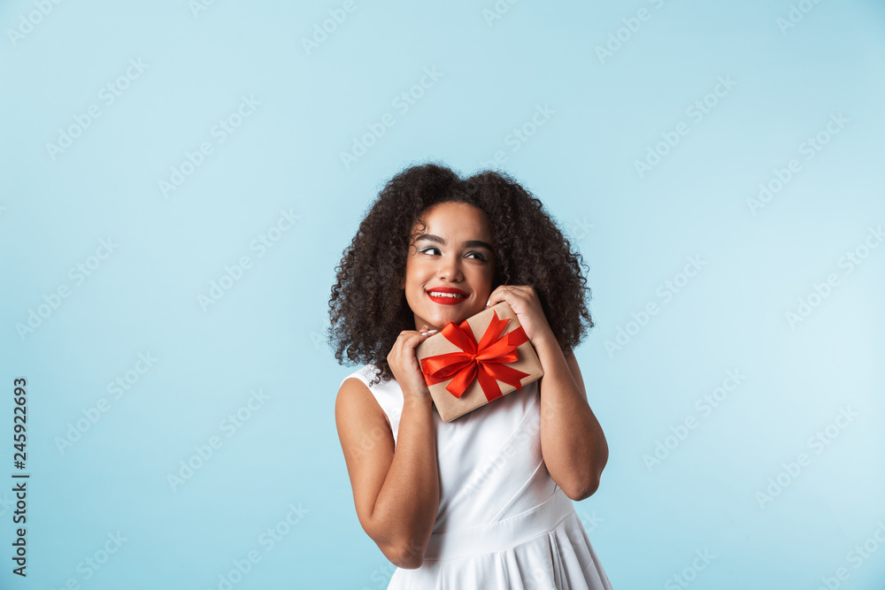 Cheerful young african woman wearing dress Cheerful young african woman wearing dress