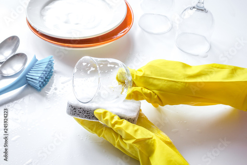 concept of woman washing dishes on white background photo