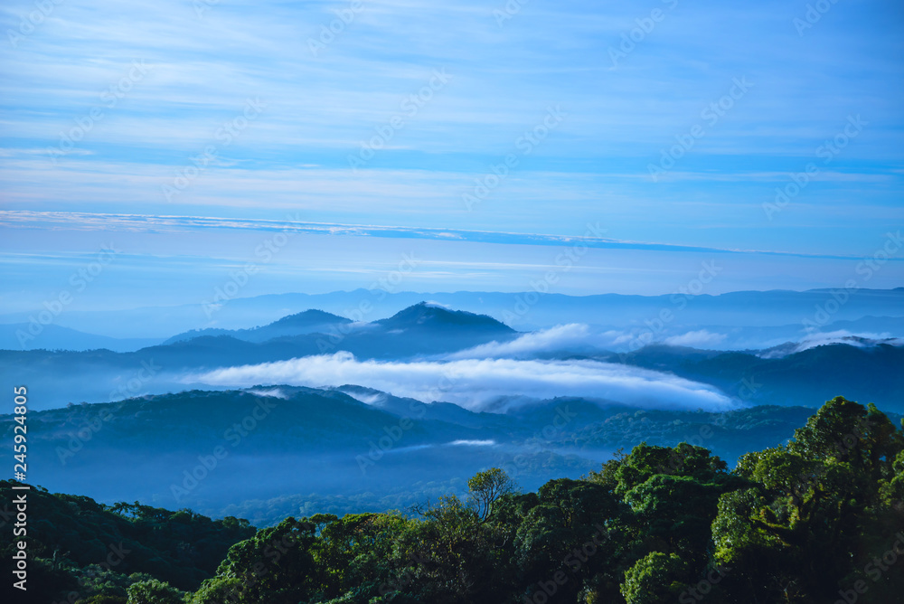 The background of nature with fog on the mountain. In the rainy weather in the countryside. winter