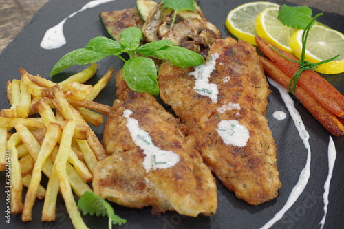  fried fish with vegetables photo