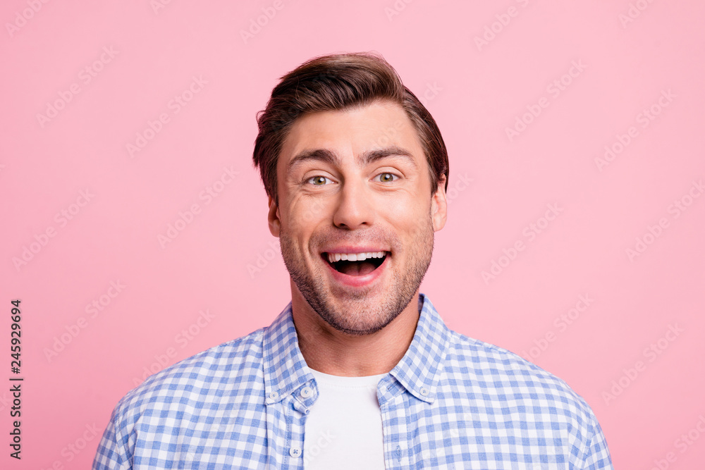 Close up photo of attractive amazing he him his man wondered about football soccer match glad it begins wearing casual plaid shirt outfit isolated on pale rose background Close up photo of attractive amazing he him his man wondered about football soccer match glad it begins wearing casual plaid shirt outfit isolated on pale rose background